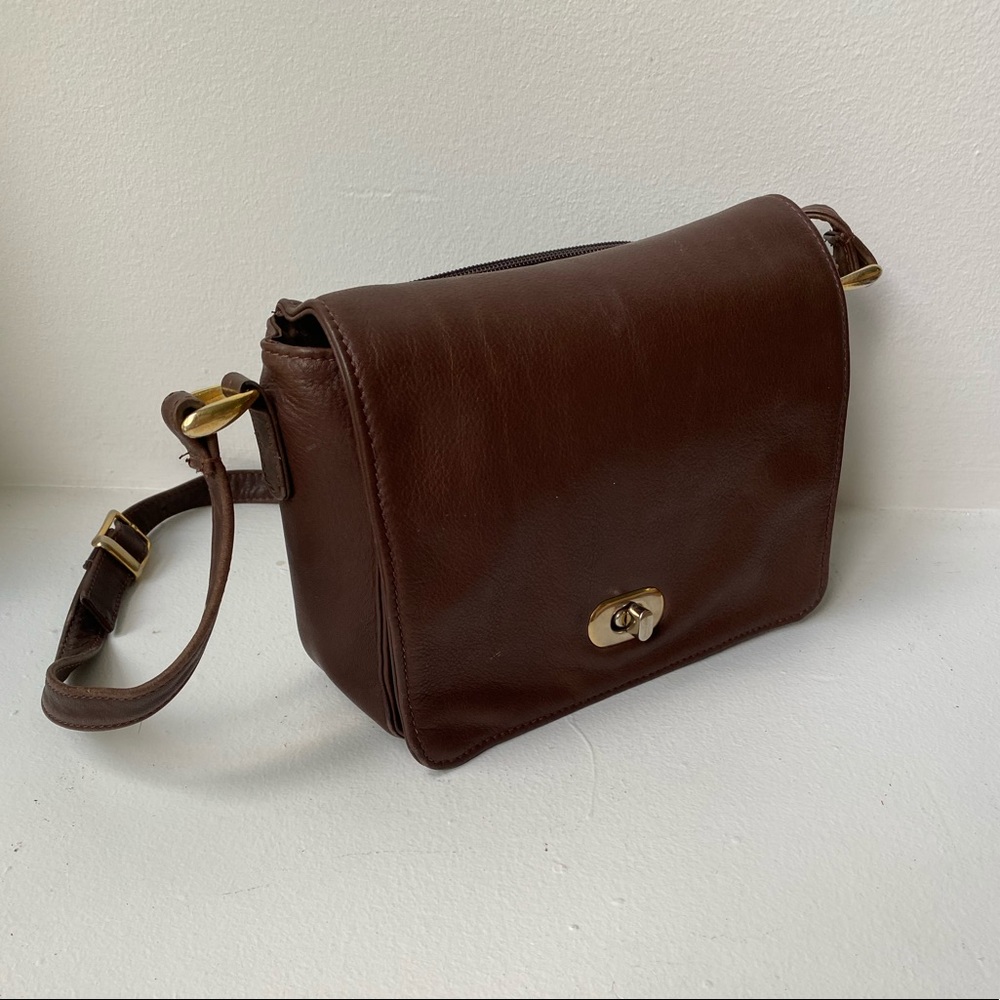 Brown leather purse with brass hardware